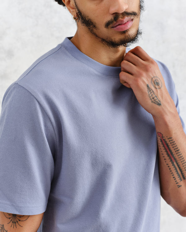 model wearing wax london mid blue textured organic cotton t-shirt