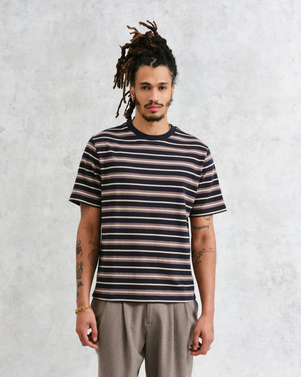 model facing front wearing wax london navy striped textured organic cotton t-shirt