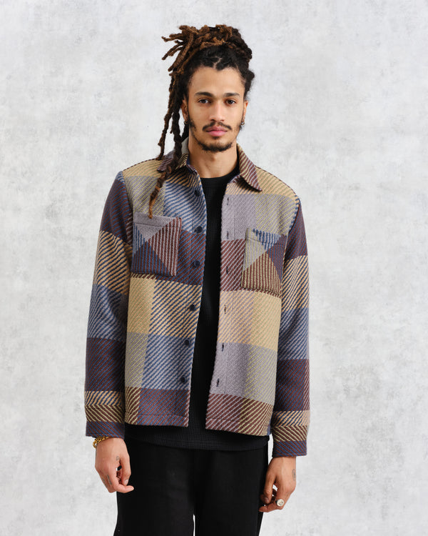 model facing front wearing multi colour square check overshirt